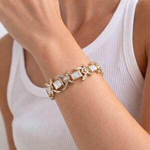 VINTAGE 1950s Gold Tone Heraldic Sword Link Bracelet Satin Panels